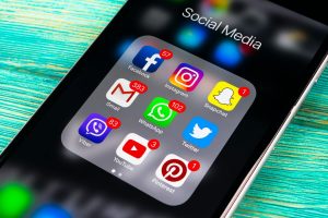 various social media apps on smartphone with notifications