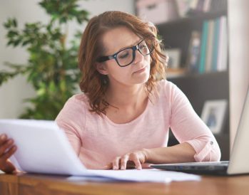 Woman using creative blog titles for travel websites