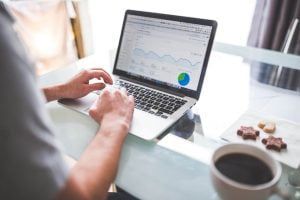 corporate traveler sitting at a comfortable desk planning hotel marketing to business travelers