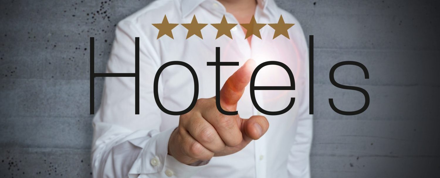 5 star rating Hotels touchscreen is operated by man