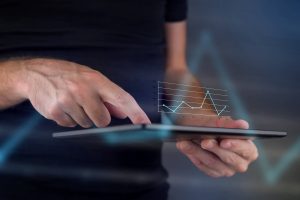 Tablet with a 3D line graph hologram