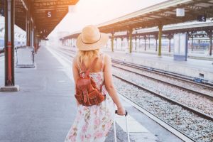 girl traveling by train. destination marketing.