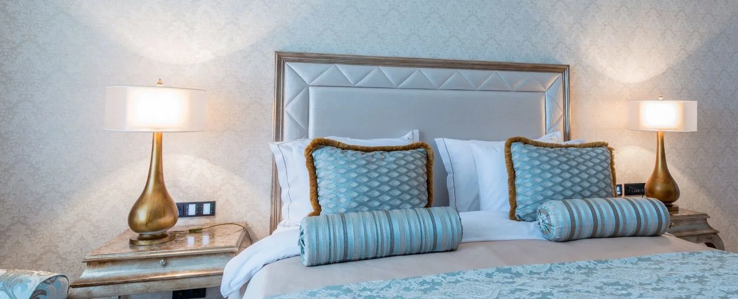 Bedroom with blue and brown linens