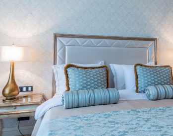 Bedroom with blue and brown linens