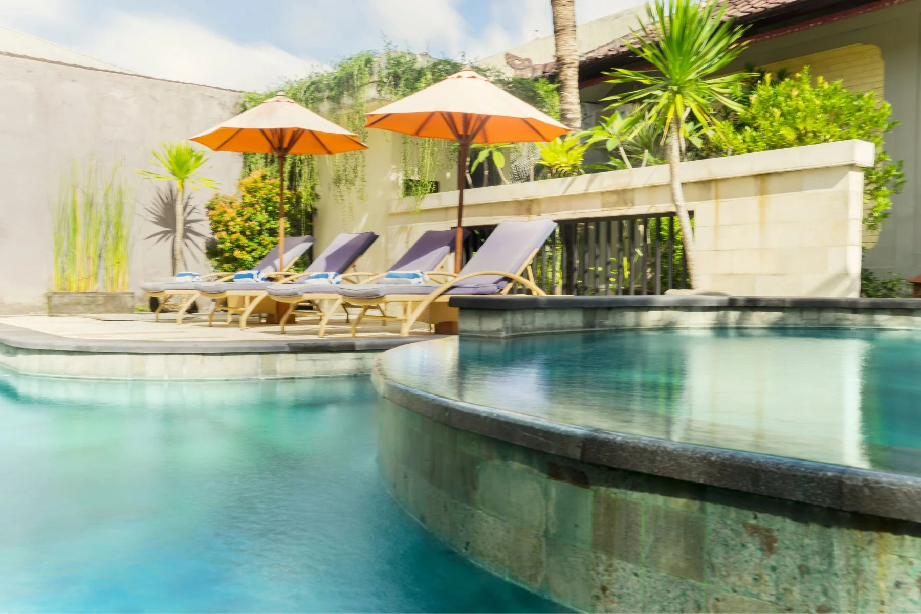 poolside view with hot and lounge chairs