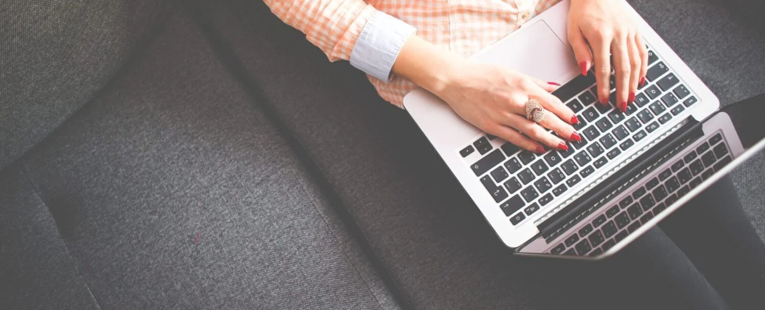 Woman sitting with laptop